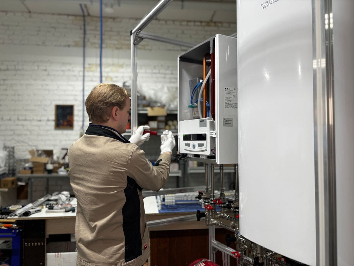 Gas Safe heating engineer servicing a boiler in a Walker home
