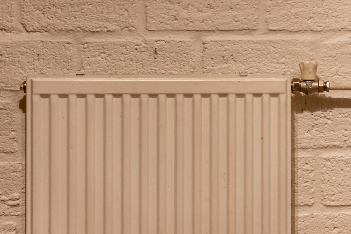 Clean white radiator on a wall after a central heating power flush